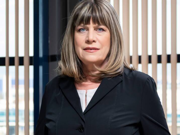 Rumyana Betova, Executive Director of Euroins Bulgaria, in front of Premium Lifestyle magazine